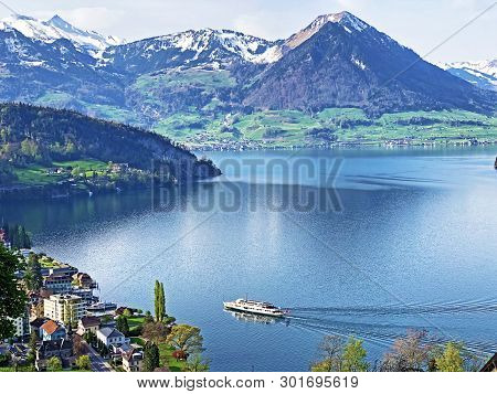 View Of Lake Lucerne Or Vierwaldstaetersee With Vitznau Settlement And Swiss Alps In The Background 