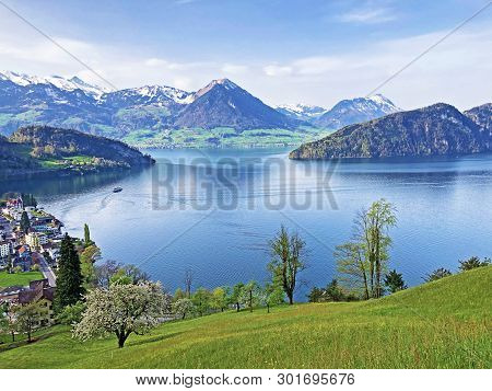 View Of Lake Lucerne Or Vierwaldstaetersee With Vitznau Settlement And Swiss Alps In The Background 