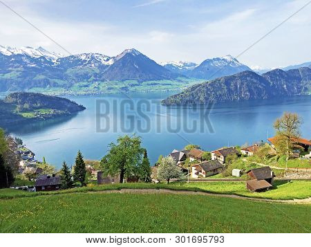 View Of Lake Lucerne Or Vierwaldstaetersee With Vitznau Settlement And Swiss Alps In The Background 
