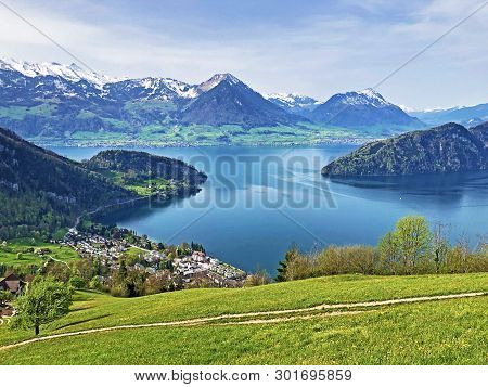 View Of Lake Lucerne Or Vierwaldstaetersee With Vitznau Settlement And Swiss Alps In The Background 