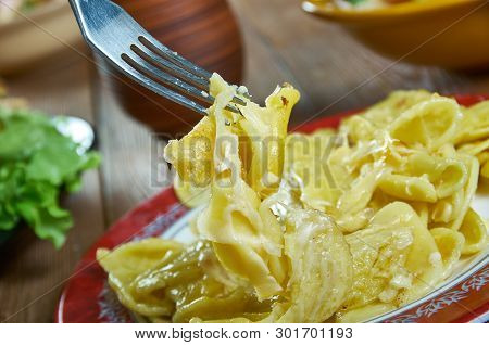 Kasespatzle - Hot Spatzle And Grated Granular Cheese , Austrian National  Cuisine, Traditional Assor
