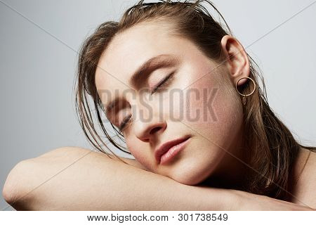 Beauty Portrait Of A Pretty Young Topless Femle With Natural Makeup Over White Background. Cosmetolo