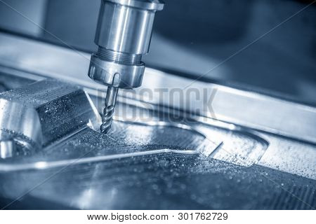The  Cnc Milling Machine Cutting The Mould Part With The Solid Ball End Mill Tool.the Hi-technology 