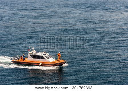 Bali, Indonesia - February 25, 2019: Outside Benoa Port. Closeup Of Orange Pilot Boat Drawing A Whit