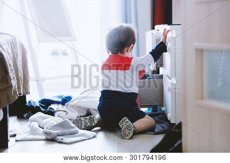 Child Makes A Mess In The Closet At Home