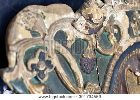 Macro Shot Of Old Icon. Restoration Of Spoiled Wooden Sculpture