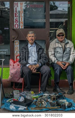 Krakow, Poland - September 21, 2018: Two Elderly Polish Vendors Waiting For Buyers.they Are Selling 