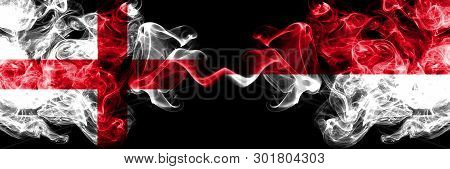 English Vs Monaco, Monacan Smoky Mystic Flags Placed Side By Side. Thick Colored Silky Smokes Flag O