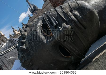 Krakow, Poland - September 23, 2018: The Head Sculpture Eros Bendato On Market Square, Made By Polis