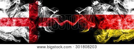 English Vs South Ossetia Smoky Mystic Flags Placed Side By Side. Thick Colored Silky Smokes Flag Of 