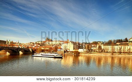 Iew On St. Vitus Cathedral And Prague Castle Across Vltava River On A Bright Autumn Day. This Image 