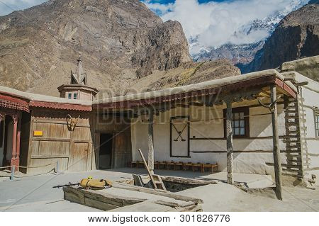 Baltit Fort In Karimabad, Hunza Valley. Unesco World Heritage Site With A View Of Clouds Covered Sno