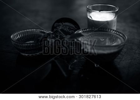Face Mask Of Devil's Dung Powder On Wooden Surface I.e. Hing Powder Well Mixed With Honey And Milk.u