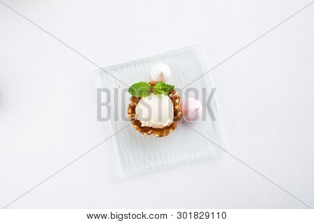 Vanilla Ice Cream With Meringe And Mint In A Wafer Bowl Isolated On White Background Top View