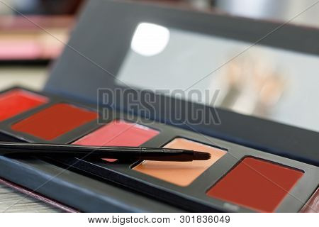 Palette With Lip Gloss, Brush On The Table In The Beauty Salon
