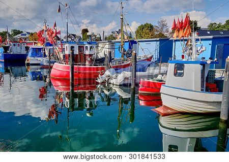 Colorful Fisherboats In A Port On The Island Of Fehmarn In Germany In The North Sea