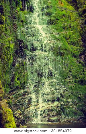 Little Waterfall In Green Summer Mountains, Norway.