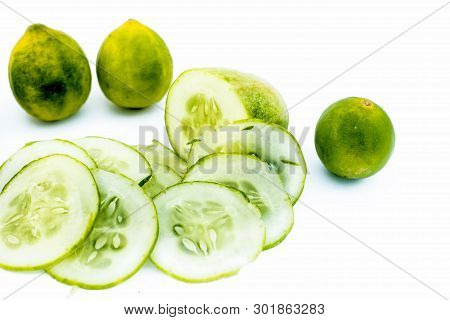 Cucumber Face Pack Isolated On White I.e. Cucumber Slices Or Cucumber Pulp Well Mixed With Turmeric