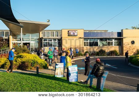 Melbourne, Australia - May 18, 2019: Political Party Supporters Handing Out How To Vote Cards Outsid