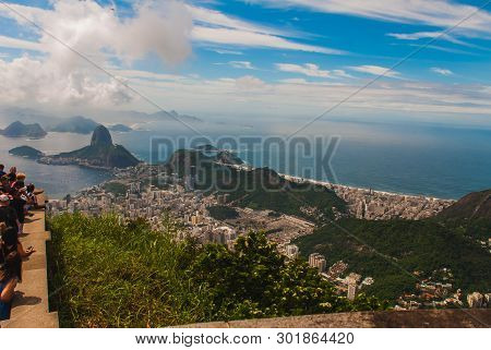 Rio De Janeiro, Sugar Loaf, Brazil: Mountain Resembling Inverted Funnel Behind Urca Hill. Tourist Si