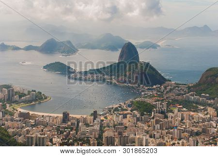Rio De Janeiro, Sugar Loaf, Brazil: Mountain Resembling Inverted Funnel Behind Urca Hill. Tourist Si