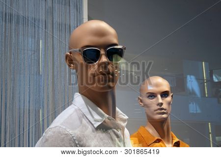 Fashionably Dressed Mannequin In Sunglas And Another One Without Sunglas On Backside. Fashion Concep