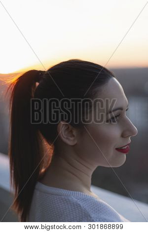 Girl Enjoying The Sunset