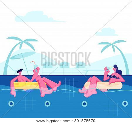 Young Happy Couple Relaxing On Resort, Floating At Inflatable Rings In Swimming Pool And Drinking Co