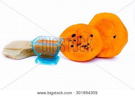 Papaya Face Pack Isolated On White I.e. Papaya Pulp Well Mixed With Multani Mitti Or Fuller's Earth 