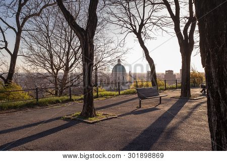 Brescia At Sunset, The Dome Of The Cathedral Captured By The Gardens Of The Medieval Castle On The H