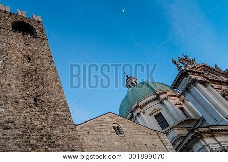 Close Up Shot Of Broletto Palace And The Cathedral On Blue Sky And The Moon In Background, Brescia, 