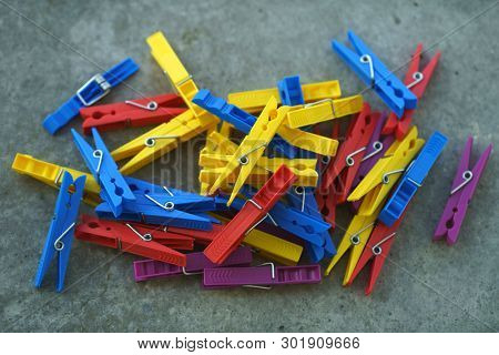 Colorful Plastic Clothespins, Clothes Pegs, Clothespins Collection, Background and Texture of Scattered Clothespins, Lots of Clothespins