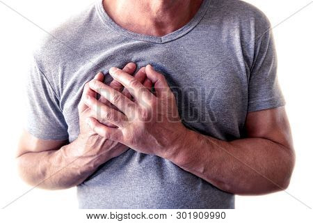 The Young Man Is Suffering From Chest Pain. Chest Spasm, Angina Pectoris. Heart Attack
