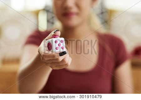 Woman Playing With Anti Stress Figet Cube Toy To Relieve Anxiety