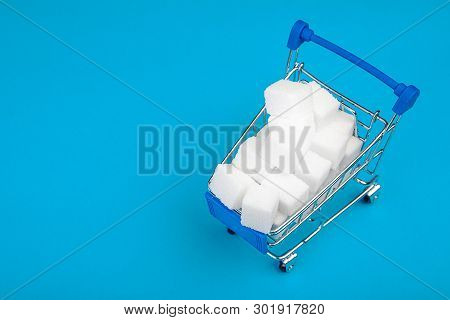 Sugar. Cubes Of Sugar In The Shopping Cart. Sugar Concept. Copy Space For Text.
