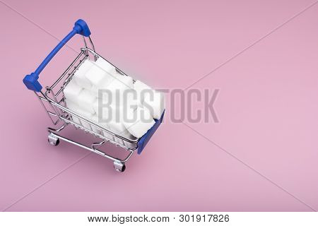 Sugar Cubes. Shopping Cart With Write Sugar Cubes Isolated On Pink Background. Sugar Concept. Top Vi