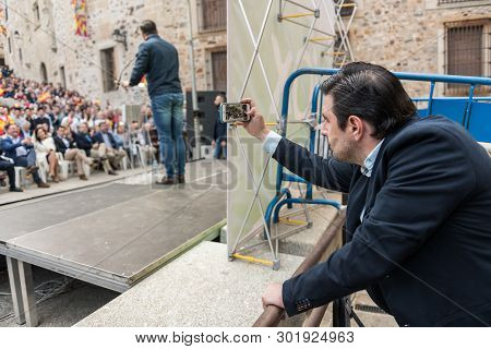 Caceres, Extremadura, Spain - May  18, 2019:  A Man Takes A Photograph Of The Intervention Of The Le