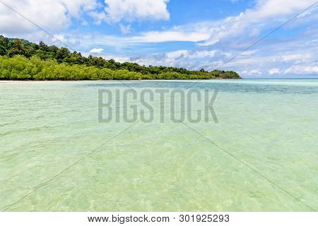 Beautiful Tropical Nature Landscape Of Clear Sea, Beach, Green Island, Cloud And Blue Sky In Summer 