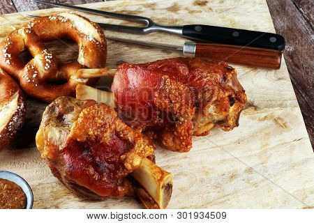 Traditional German Cuisine, Schweinshaxe Roasted Ham Hock And Pretzels
