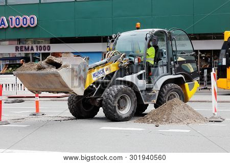 Copenhagen, Denmark - August 24, 2017: A Front Loader In Work At A Roadwok At Norreport.