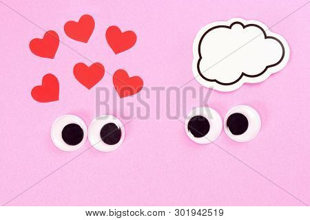 Googly Eyes Of Strange Pair Of Lovers On Rose Background With Some Small Hearts And Copy Space For T
