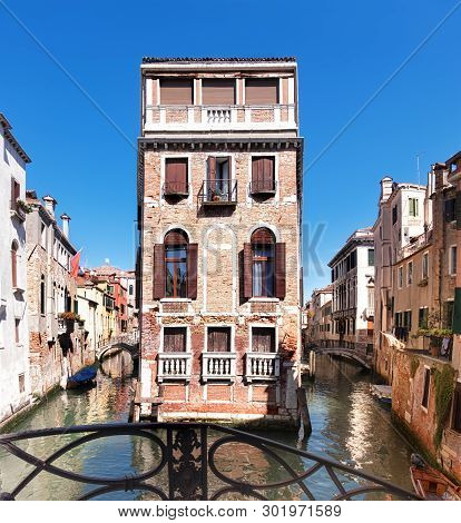 Old Houses And Waterways In Central Venice In Italy On A Bright Day