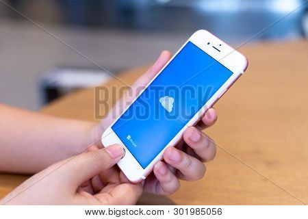 Chiang Mai, Thailand - May.10,2019: Woman Holding Apple Iphone 6s Rose Gold With Onedrive On Screen.