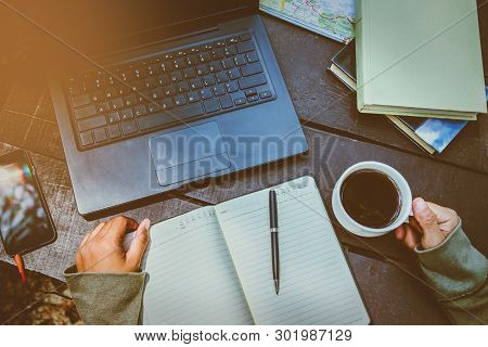 Women Who Are Working With Computers And Writing Notebooks During The Holidays. Sit, Relax, Work And