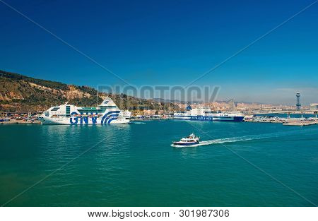 Barcelona, Spain - March 30, 2016: Ships Gnv And Grimaldi Lines In Sea Port. Travelling By Sea. Summ