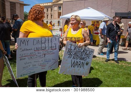 Phoenix, Arizona - May 18: Two Mothers Holding Signs At The Arizona March For Medical Freedom At The