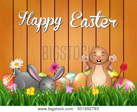 Easter Bunnies Background With Decorated Egg On The Grass