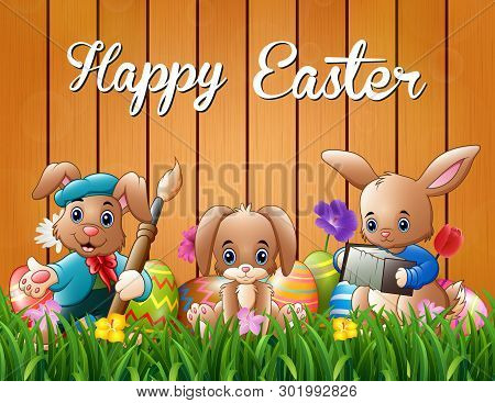Happy Easter Bunnies On A Background Fence