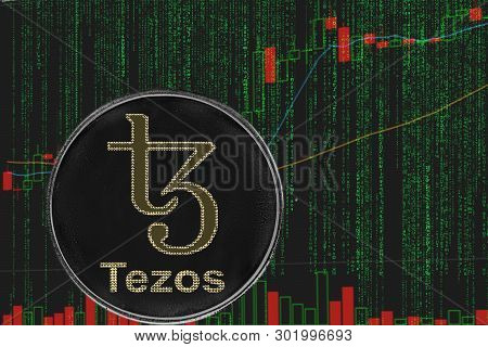 Coin Tezos Xtz Cryptocurrency On The Background Of Binary Crypto Matrix Text And Price Chart.