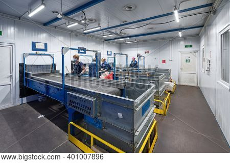Gubkin, Russia - June 12, 2020: Manual Waste Bulkhead. Waste Sorting Plant Conveyors Filled With Var